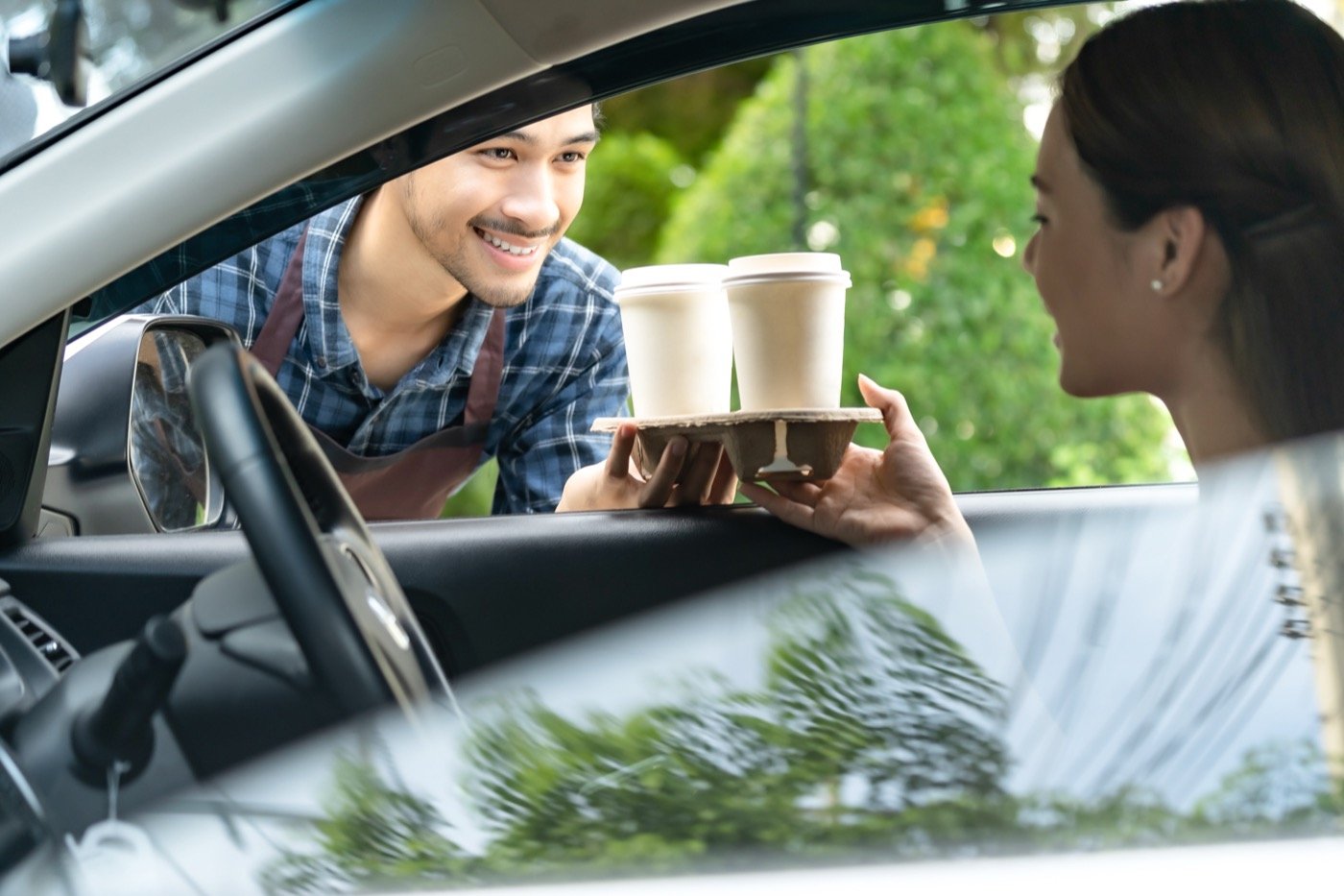Serving coffee at a drive-through window